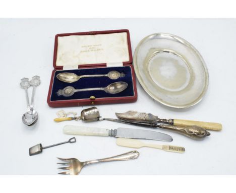 A collection of silver and silver plated items to include silver-handled button hook, silver fish knife with bone handle, sil