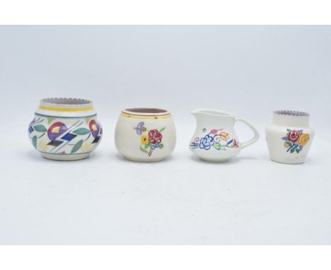 A collection of Poole Pottery to include an ovoid vase 'JV', shouldered vase 'BF', a 'BN' jug and a 'RZ' vase (4). 8.5cm tall