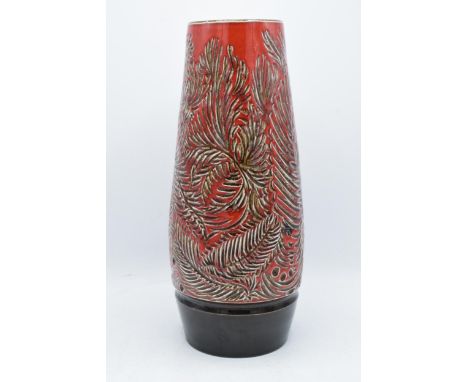 A large Poole Pottery vase with floral and leaves decoration in a deep red colourway. '85' to base. 38.5cm tall. In good cond