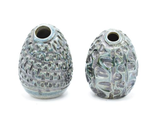A near pair of Poole Pottery Atlantis egg / grenade vases by Carol Kellett (2). Tallest 14cm. Impressed marks. In good condit