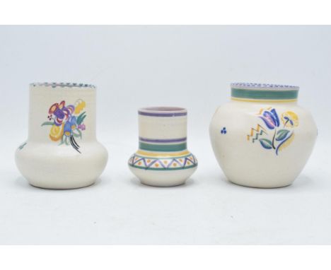 A trio of Carter Stabler Adams Limited Poole Pottery vases in the PC pattern (low shouldered vase), KY (ovoid vase) and HB pa