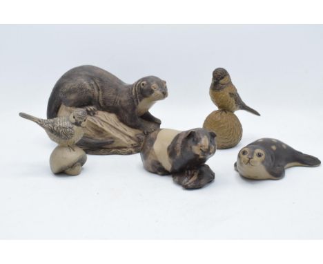 A collection of Poole Pottery stoneware-effect animals to include an otter, a seal, a guinea pig and 2 garden birds (5). Tall