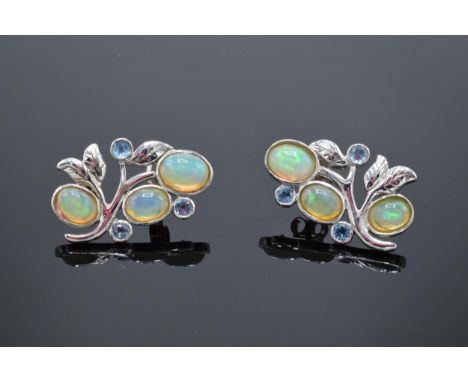 A pair of silver and opal shaped earrings (2). 