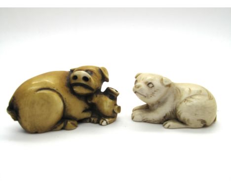 A Late XIX Century Japanese Ivory Netsuke, carved as a pig and piglet, signed 4.5cm long; Another, carved as a bear, 4cm long