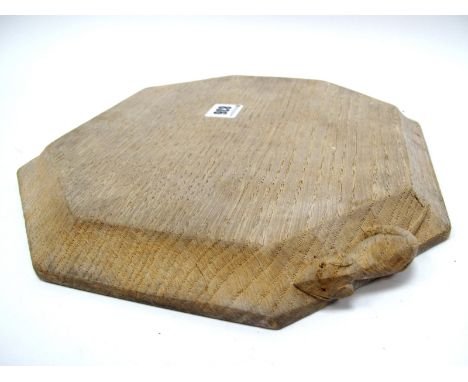 A Robert 'Mouseman' Thompson Bread Board, of canted rectangular form, carved mouse trademark, 25.5 x 30cm.