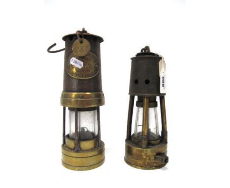 A Thomas &amp; Williams Ltd, Aberdare, Cambrian Type 9C, No. 877 Brass Miners Lamp, 33cm high including suspension hook; A St