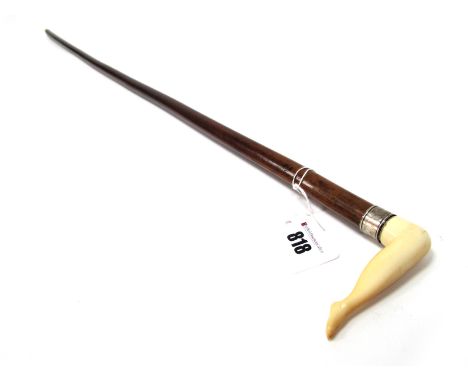 A Late XIX Century Walking Stick, the ivory handle carved as a naked female leg, inscribed white metal mounts, 89cm long (cra