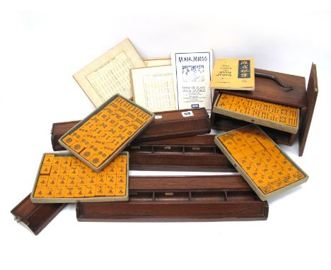 An Early XX Century Boxed Mah Jong Set, with four pull out drawers, four players counter holders and instruction manual.