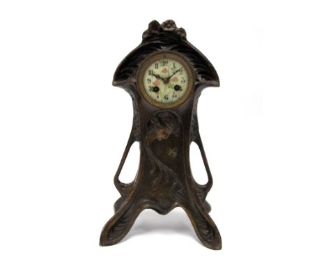 An Art Nouveau Bronzed Metal Mantel Clock, of shaped footed form, cast with a lady with sinuous flowing hair, butterfly and f