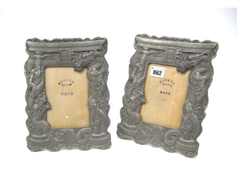 A Pair of Mid XX Century White Metal Photograph Frames, each cast with dragons entwining pillars and central rectangular pane