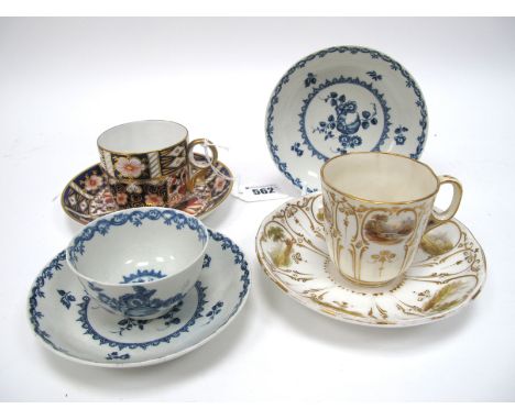 An XVIII Century Worcester Porcelain Tea Bowl and Two Saucers, painted in underglaze blue with panels of fruit and flowers, c