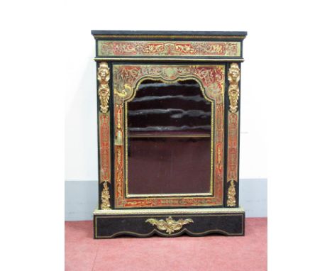A XIX Century Ebonised Boulle Cabinet, with ormolu mounts, glazed door to internal shelf, on shaped base, 110cm high, 81cm lo