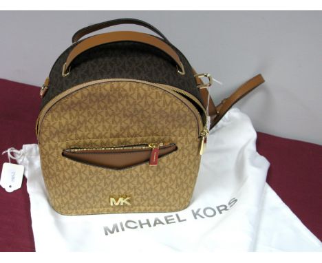 Michael Kors; A Jessa SM Convertable Backpack Bag, in brown and beige signature print, tan leather straps, gold tone hardware