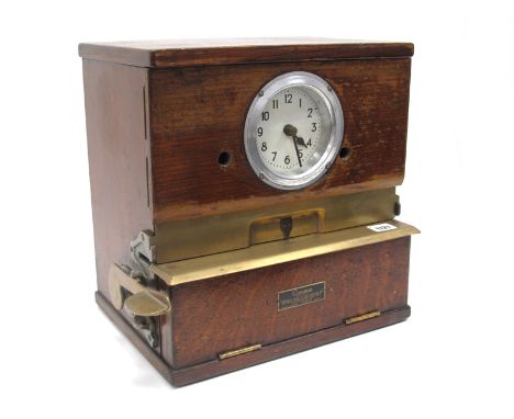 An Early XX Gensign Clocking On Machine, the oak brass mounted case with white enamel dial with Arabic numerals, manufacturer