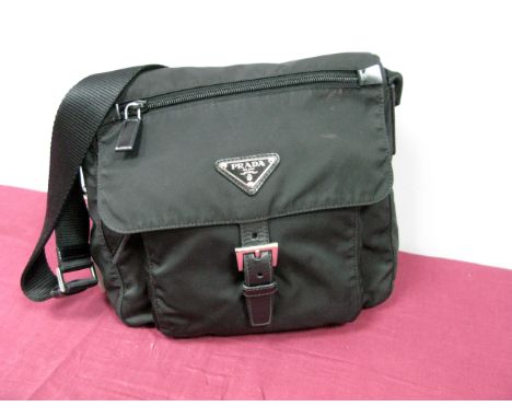 Prada; A Black Fabric Crossbody Shoulder Bag, with top zipper closure and front outer pocket with leather strap and buckle fa