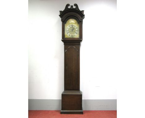 An XVIII Century Oak Eight-Day Longcase Clock, the hood with brass finials, swan neck pediment and arched door, the brass dia