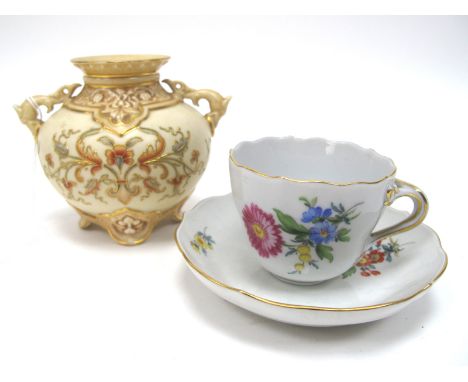 A Meissen Porcelain Cabinet Cup and Saucer, decorated with colourful floral sprays within shaped rims, crossed swords marks; 