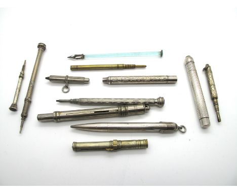 A Collection of Eleven White Metal and Brass Propelling Pencils, some with chased/fluted decoration, 6cm to 10cm long and a b