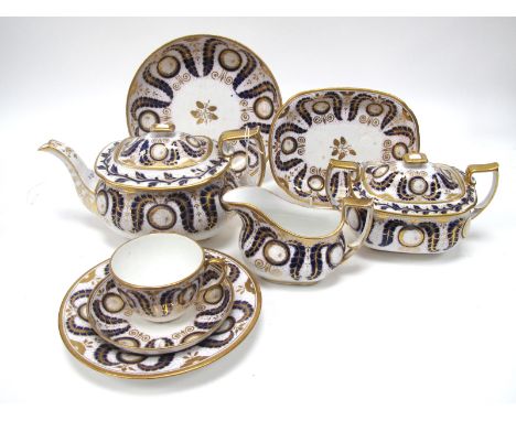 An Early XIX Century Porcelain Part Tea and Coffee Service, decorated in pattern 444, in dark blue and gilt with scrolling fo