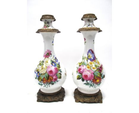 A Pair of Late XIX Century Lamp Bases, the opaque glass pear shaped bodies painted with colourful sprays of flowers on a whit