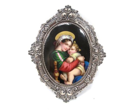 A Late XIX Century Continental Oval Enamel Plaque, printed and painted in a study of the Madonna and Child, in an ornate silv