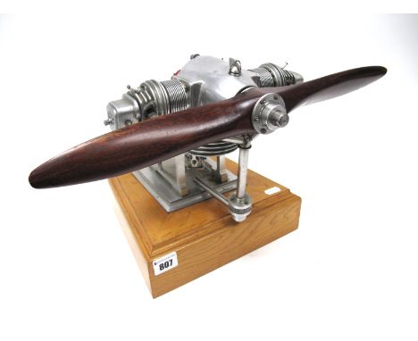 A 1:4 Scale Model of an Aeronca E113 Twin Opposed Aircraft Engine, liquid fuel powered, measuring approximately 9.5" wide, bu