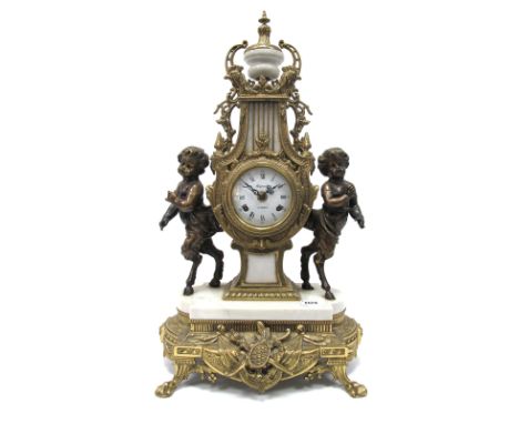 A French Reproduction Brass Clock, the lyre shaped case with white enamel dial with Roman numerals and inscribed "Regnault á 