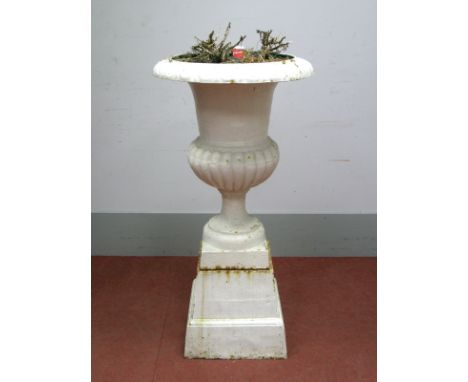 A XIX Century Cast Iron Garden Urn on Stand, with egg and dart moulding to the top, lobed pedestal, on a plinth base, 106cm h