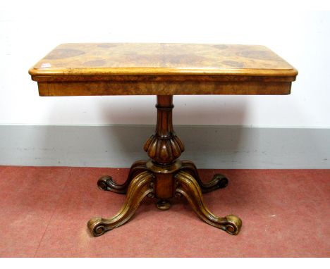 A Mid XIX Century Walnut Card Table, the quarter veneered top with moulded edge to baized interior, on turned and reeded pede