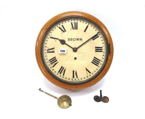 An Early XX Century Oak Cased Wall Clock, the cream enamel dial with Roman numerals and inscribed "Brown Made in England", fu