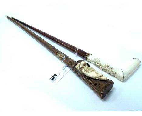 A Late XIX Century Walking Stick, the ivory handle carved with 'Toby', Mr Punch's dog, wearing a hat and scarf, gilt metal em