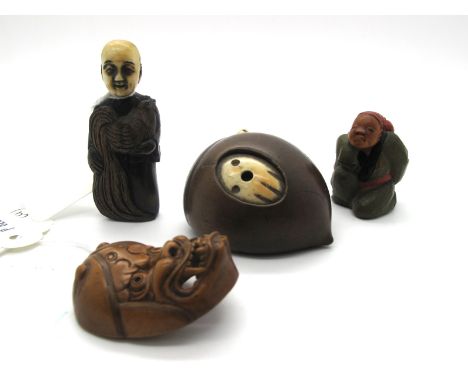 A Late XIX Century Japanese Boxwood Mask Netsuke, of an Oni with open mouth, signed, 4cm long; A Japanese Wooden Netsuke, car