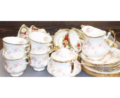 THREE PART ROYAL ALBERT FLORAL TEA SETS
including a set of four cups and saucers with cream and sugar, and two sets of two cu