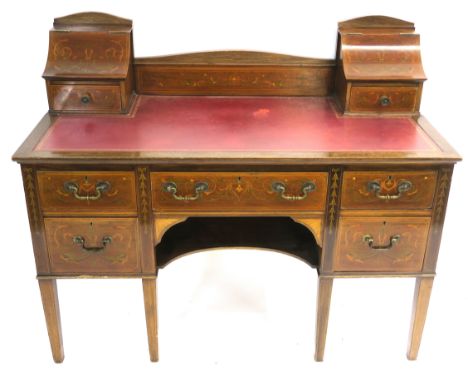 AN EDWARDIAN MAHOGANY INLAID AND PAINTED WRITING DESK decorated with dolphins and scrolling foliage set with two drawers and 