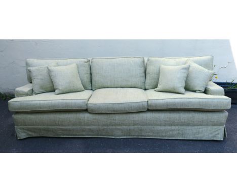 A PETER DUDGEON LARGE GREEN UPHOLSTERED SOFA, with scatter cushions and spare seat covers, 80cm high x 250cm wide x 92cm high