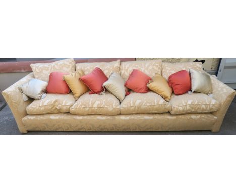 A VERY LARGE CREAM SOFA, with scatter cushions, 80cm high x 312cm wide x 100cm deep Condition Report: Available upon request