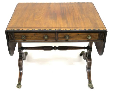 A MAHOGANY AND CROSSBANDED SOFA TABLE the rectangular top with twin flaps and with coromandel banding, above two drawers and 