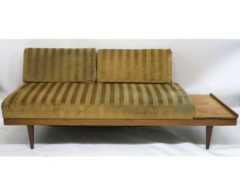 A MID CENTURY INGMAR RELLING TEAK SOFA BED, with adjustable side shelf and lower compartment, 76cm high x 195cm wide x 75cm d