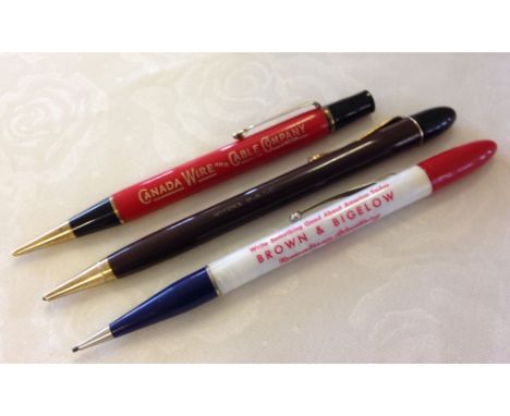 Collection of three propelling pencils c1930s.Pencil One: Tobacco brown barrel with rolled gold cone and clip, black section 