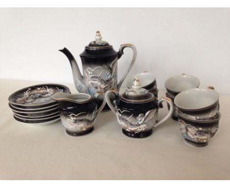 An oriental coffee set with pointed Dragon & Flaming Pearl decoration.