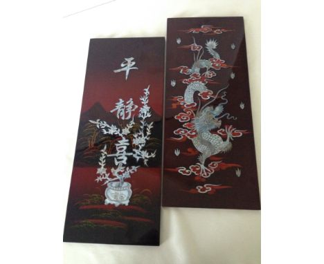 A pair of modern oriental panels set with mother of pearl decoration 49 x 20cm