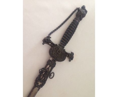 An American Knights of Pythias masonic style sword c1865-70 with metal scabbard. A chain runs from the Knights Head pommel to