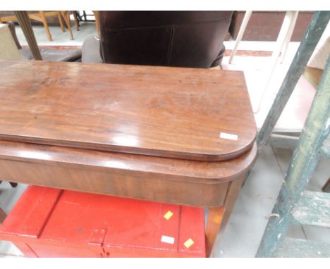 A 19th century mahogany tea table having fold over top, on tapered gate legs