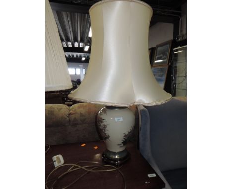 A large floor standing ceramic lamp