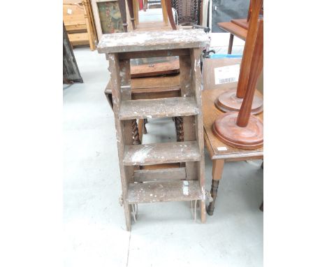 A set of vintage wooden step ladders