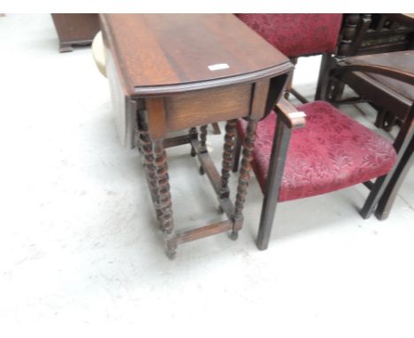 A mid 20th Century oak twist gate leg occasional table