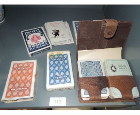 A selection of playing card sets including Senior service
