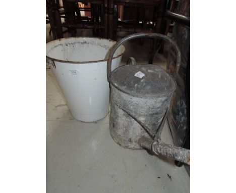 A galvanised watering can and white enamel  bucket