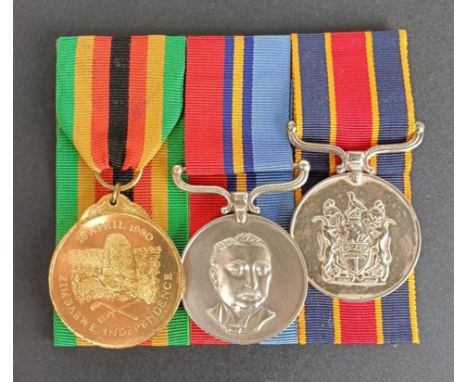 A group of three medals, awarded to 10755P F/R Huggins MJ, comprising a Zimbabwe Independence medal, a General Service medal 