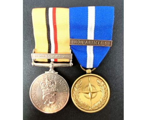 A pair of medals, awarded to OM (W) 1 K M Cole W145036B RN, comprising an Iraq medal with 19 Mar to 28 Apr 2003, and a NATO S